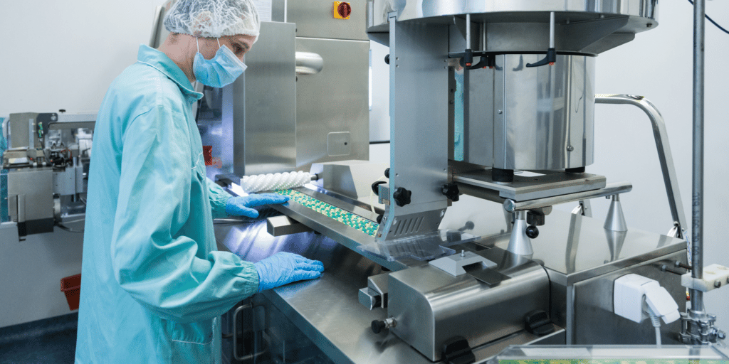 pharmaceutical-industry-man-worker-protective-clothing-operating-production-tablets-sterile-working-conditions